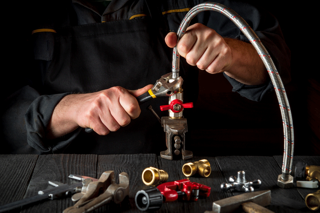 man tightening plumbing piping Gas Line Leak Detection & Repair florence sc quinby sc 