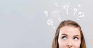 Question marks with young woman, Plumbing System Audits.